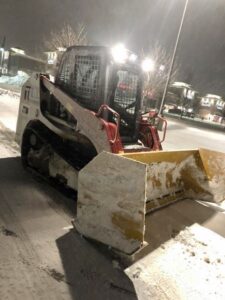snow removal service in greenwood minnesota at night
